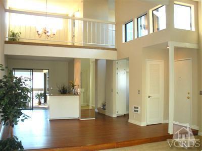3058 Sunset Lane Oxnard, CA 93035 - Photo 2 of 10 a view of an entryway with wooden floor and a kitchen view