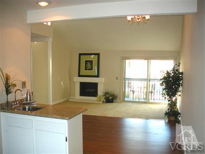 3058 Sunset Lane Oxnard, CA 93035 - Photo 3 of 10 a kitchen with a sink and a large mirror