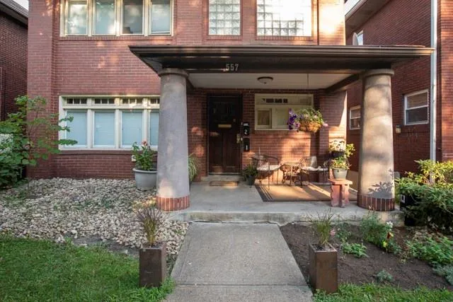 a view of front door of house with outdoor seating