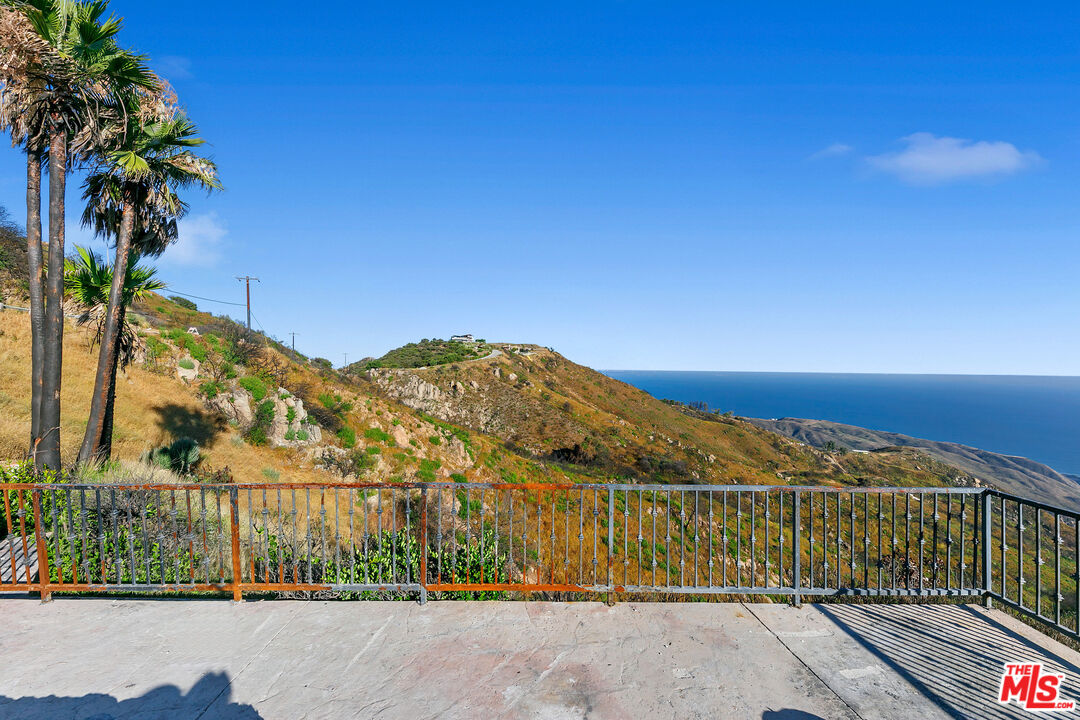 23010 Saddle Peak Road Topanga, CA 90290 - Photo 12 of 51 a view of a large building with a ocean view