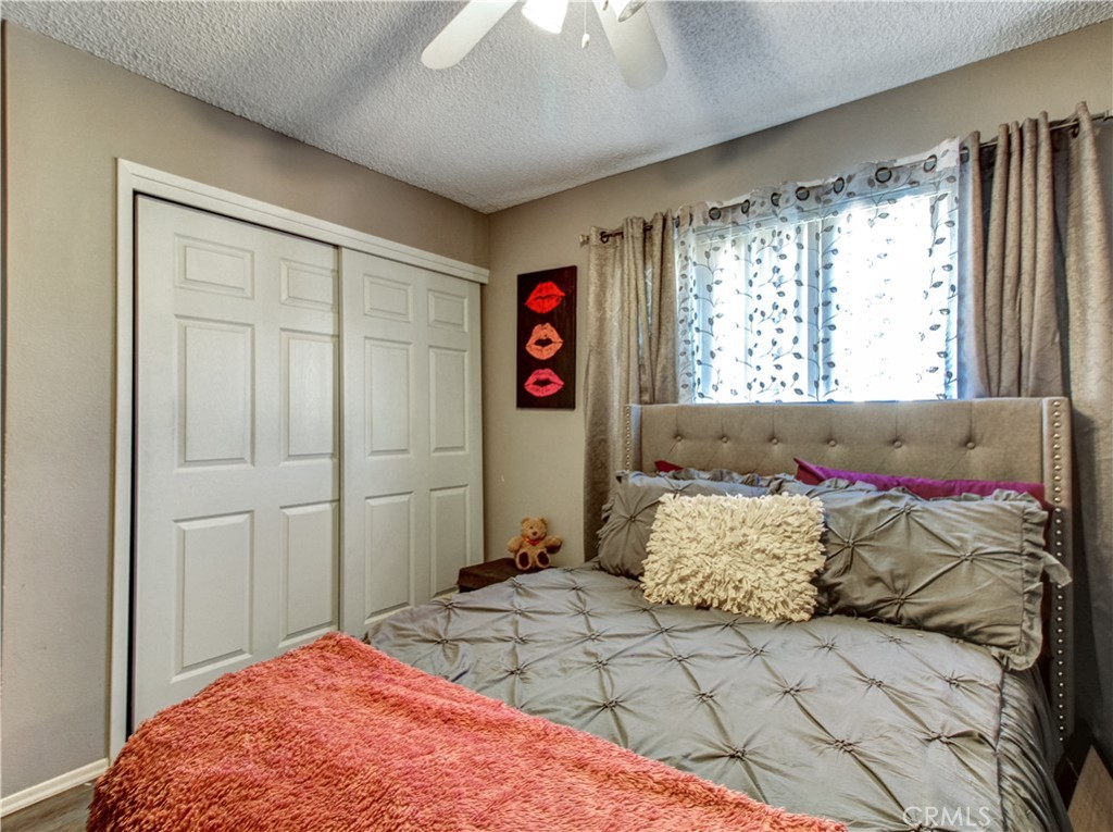 1669 Erin Avenue Upland, CA 91784 - Photo 12 of 27 a bedroom with a bed and a window