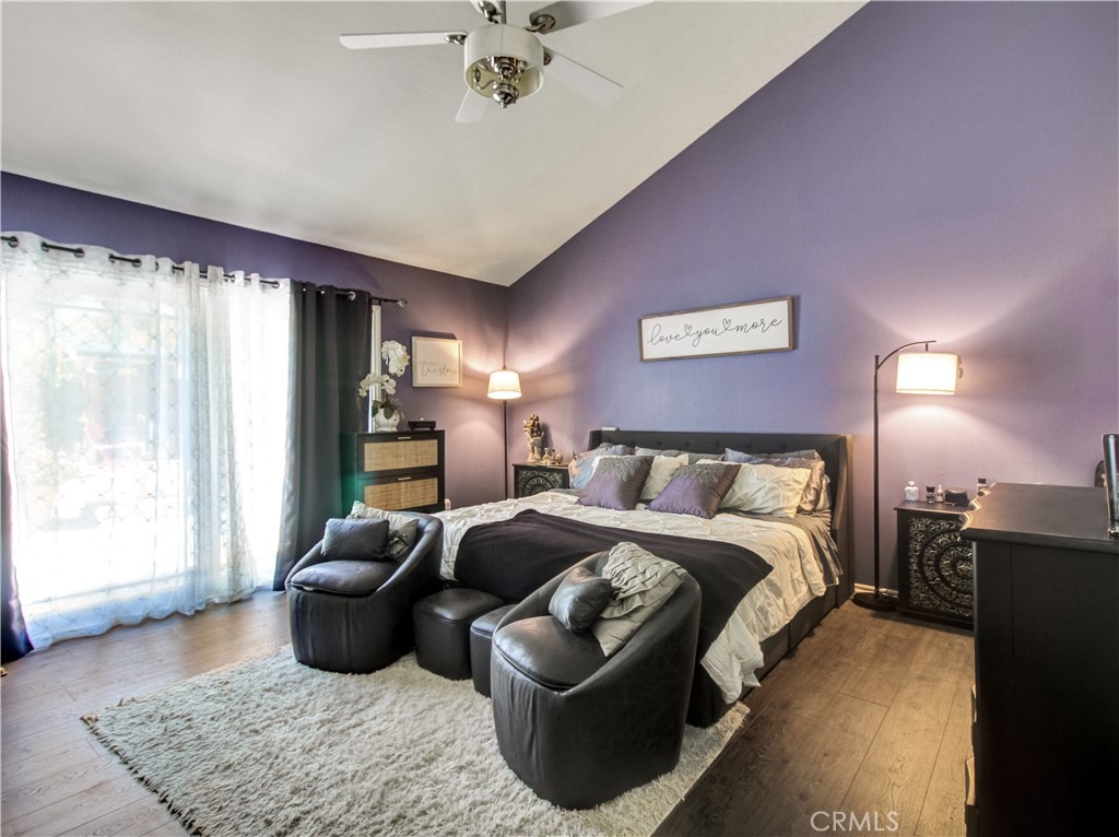 1669 Erin Avenue Upland, CA 91784 - Photo 15 of 27 a spacious bedroom with a bed a couch and large window