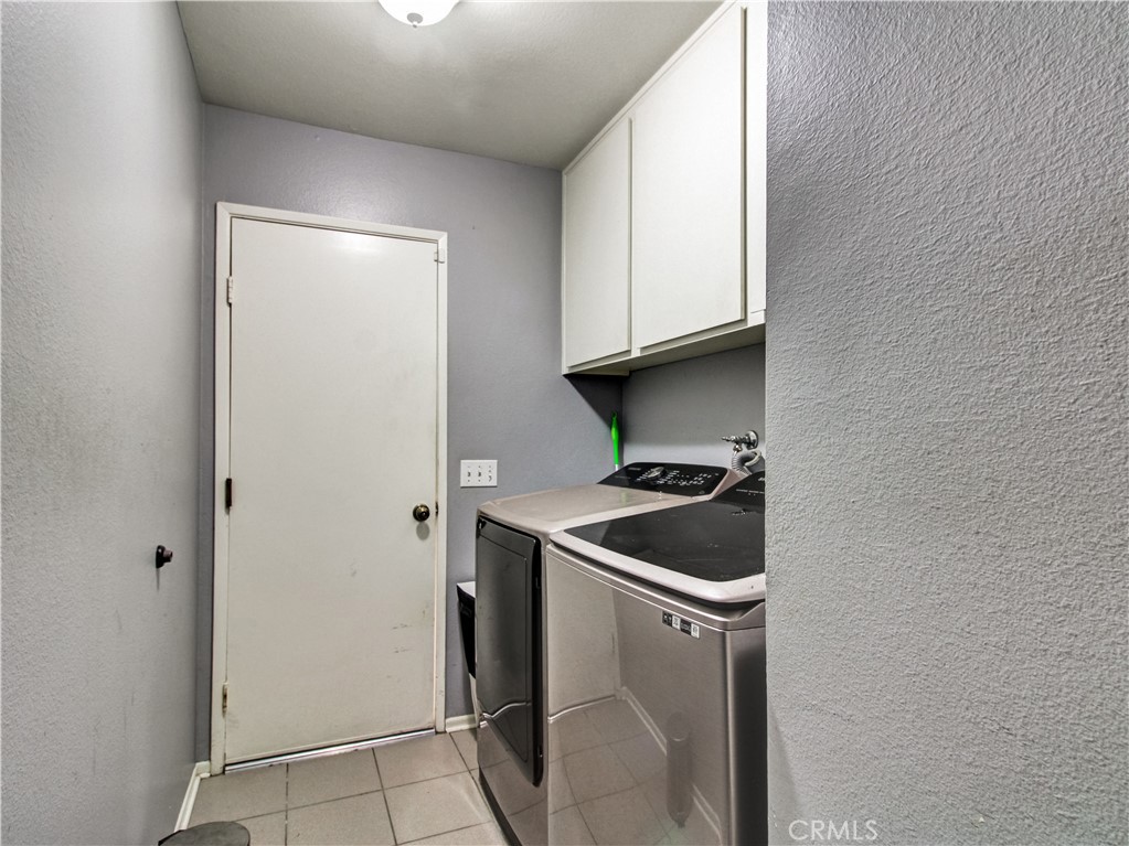 1669 Erin Avenue Upland, CA 91784 - Photo 19 of 27 a room with a sink and cabinets
