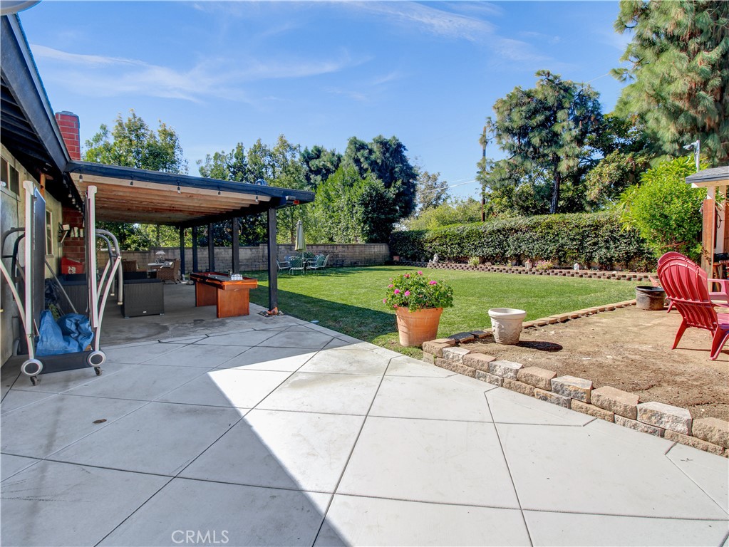 1669 Erin Avenue Upland, CA 91784 - Photo 23 of 27 a view of a backyard with plants and a patio