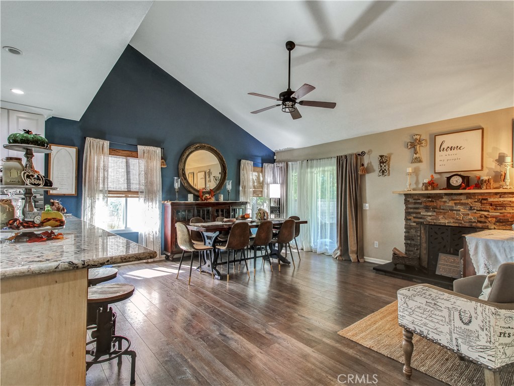 1669 Erin Avenue Upland, CA 91784 - Photo 5 of 27 a living room with furniture a fireplace and a flat screen tv