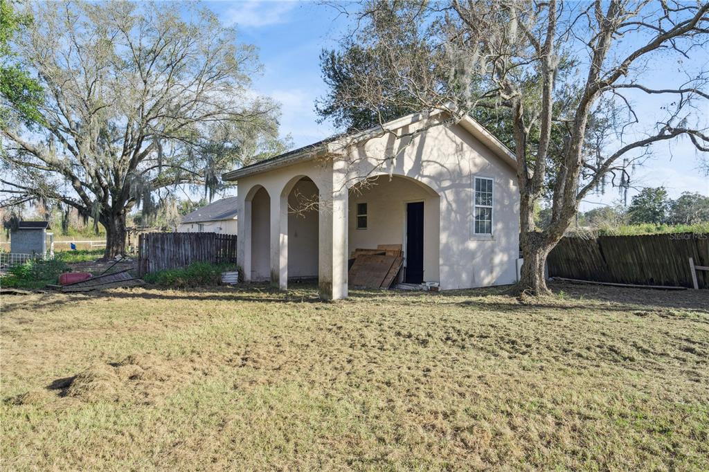 434 Diamond Acres Road Davenport, FL 33837 - Photo 17 of 20 a house with trees in front of it