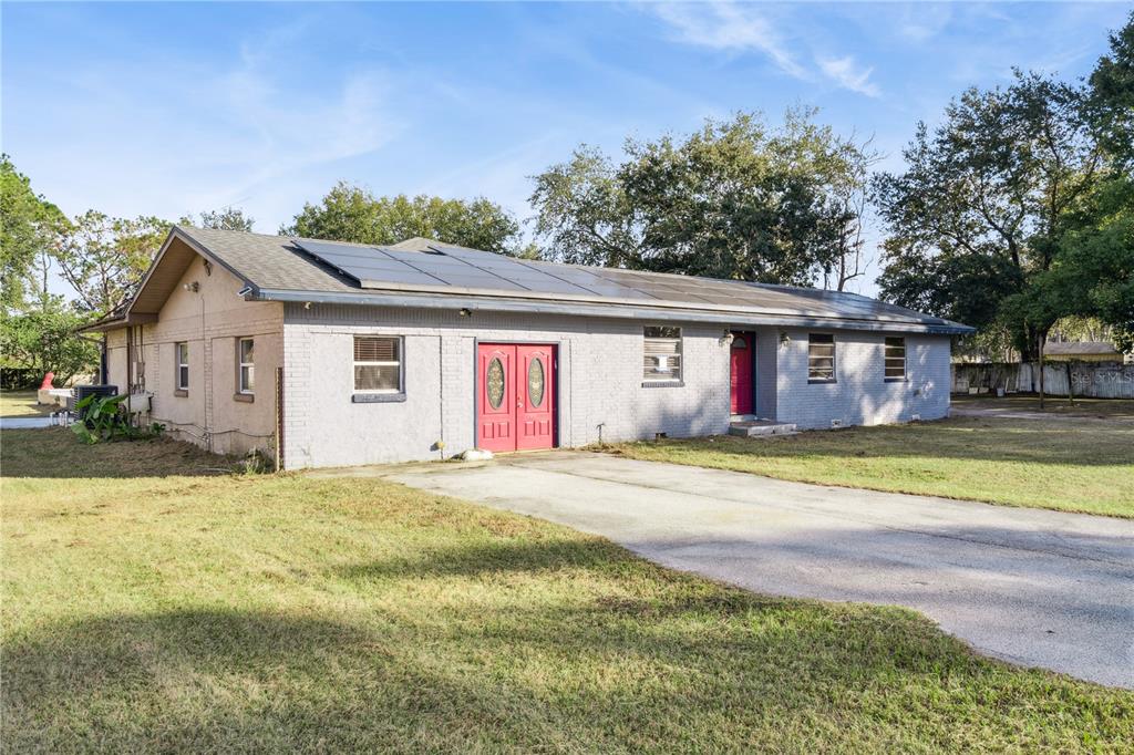 434 Diamond Acres Road Davenport, FL 33837 - Photo 2 of 20 a view of an house with backyard space and balcony