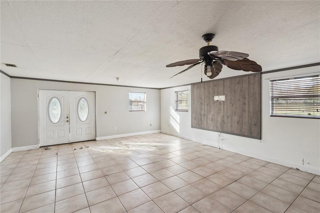 434 Diamond Acres Road Davenport, FL 33837 - Photo 4 of 20 a view of an empty room and window