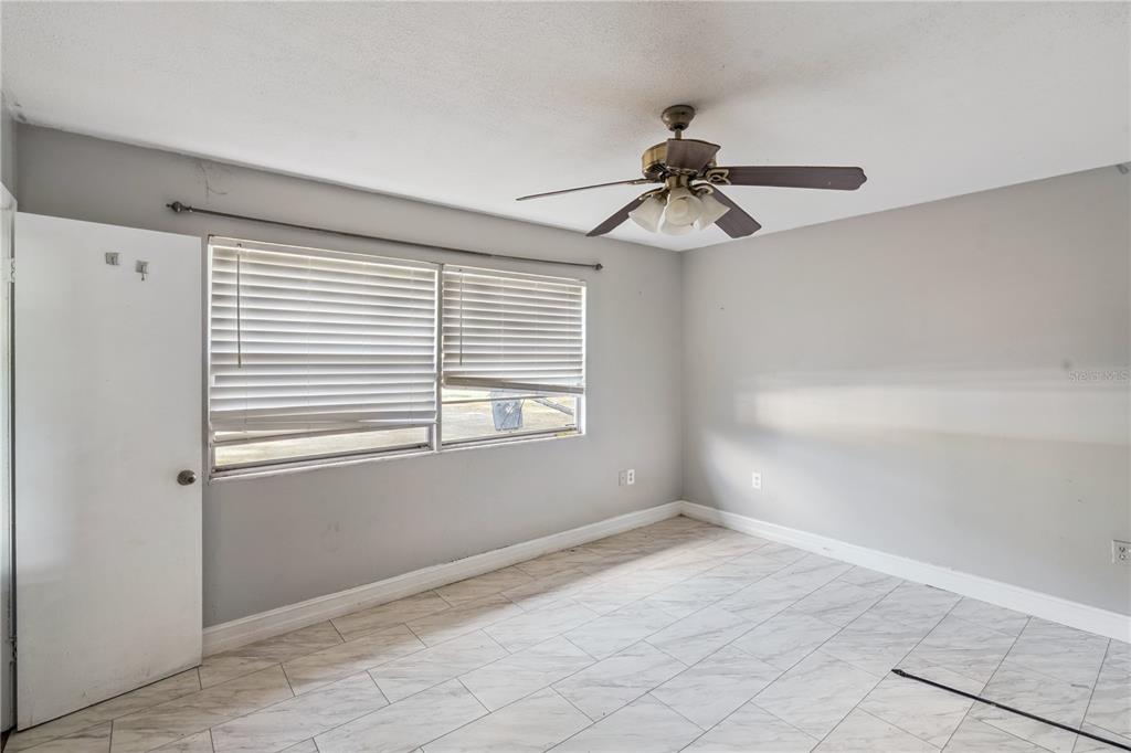 434 Diamond Acres Road Davenport, FL 33837 - Photo 8 of 20 a view of an empty room with a window