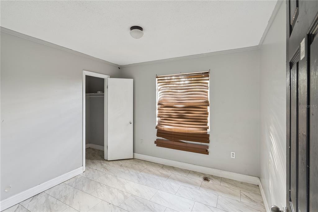434 Diamond Acres Road Davenport, FL 33837 - Photo 9 of 20 a view of an empty room with a window