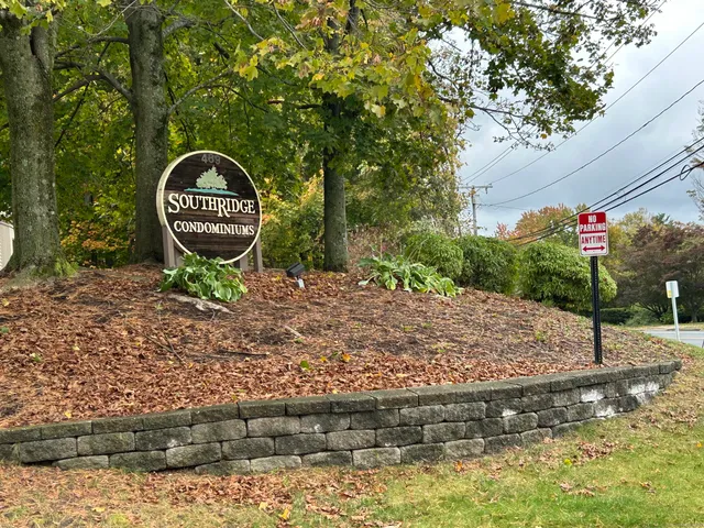 a backyard of a house with barbeque oven