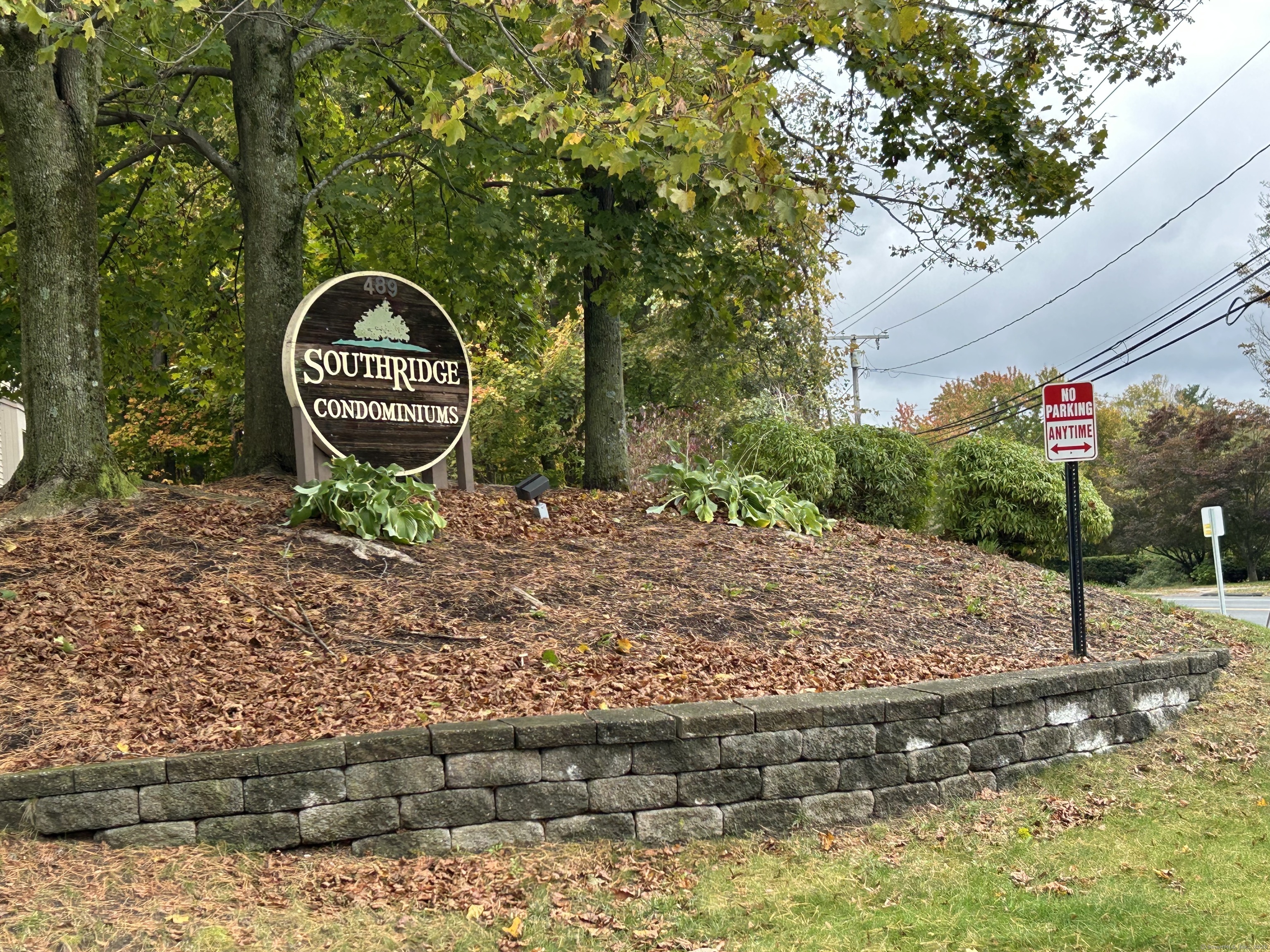 a backyard of a house with barbeque oven