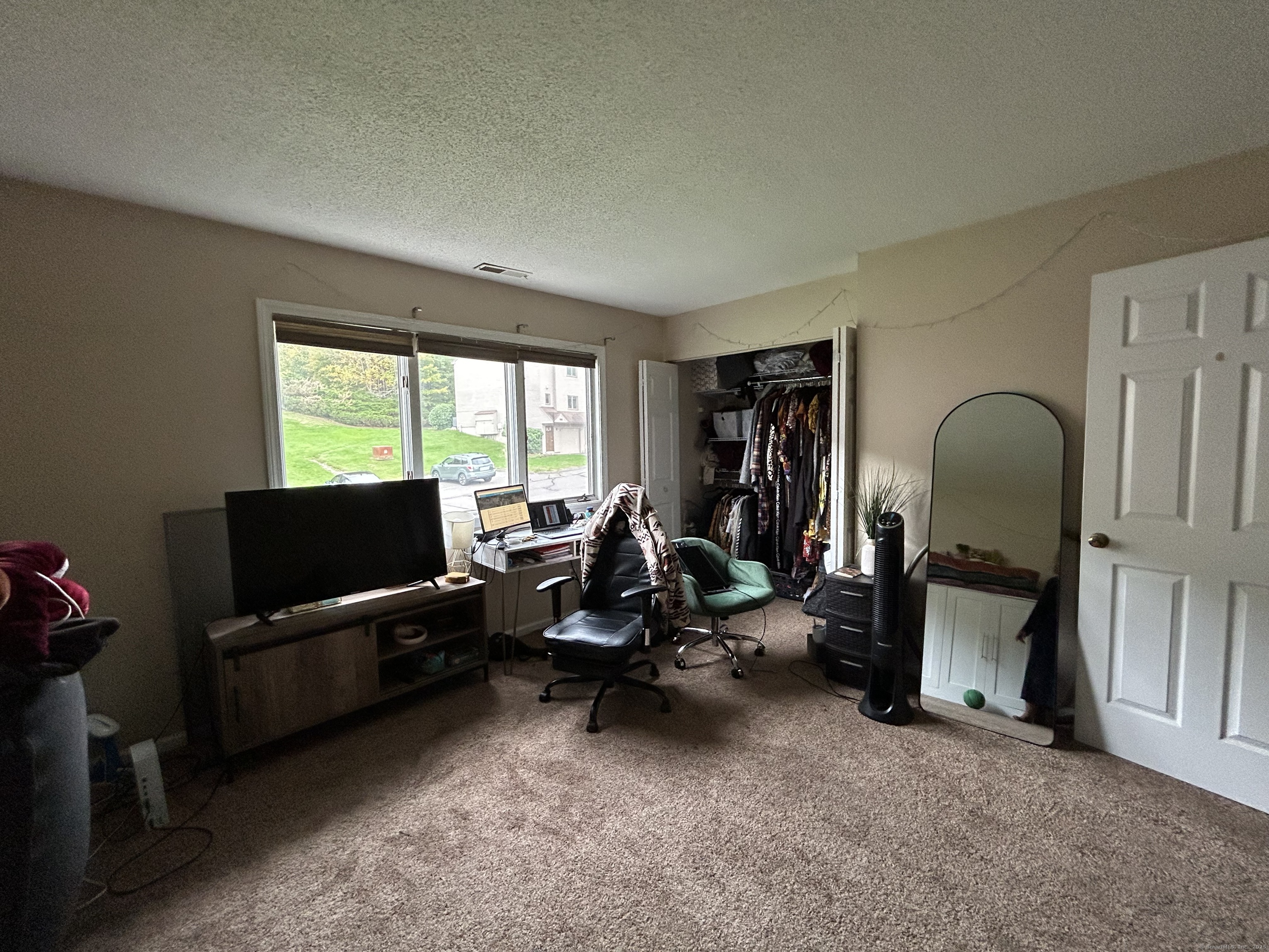 489 Wolcott Street, Unit 85 Bristol, CT 06010 - Photo 11 of 17 a view of a livingroom with workspace and a couch