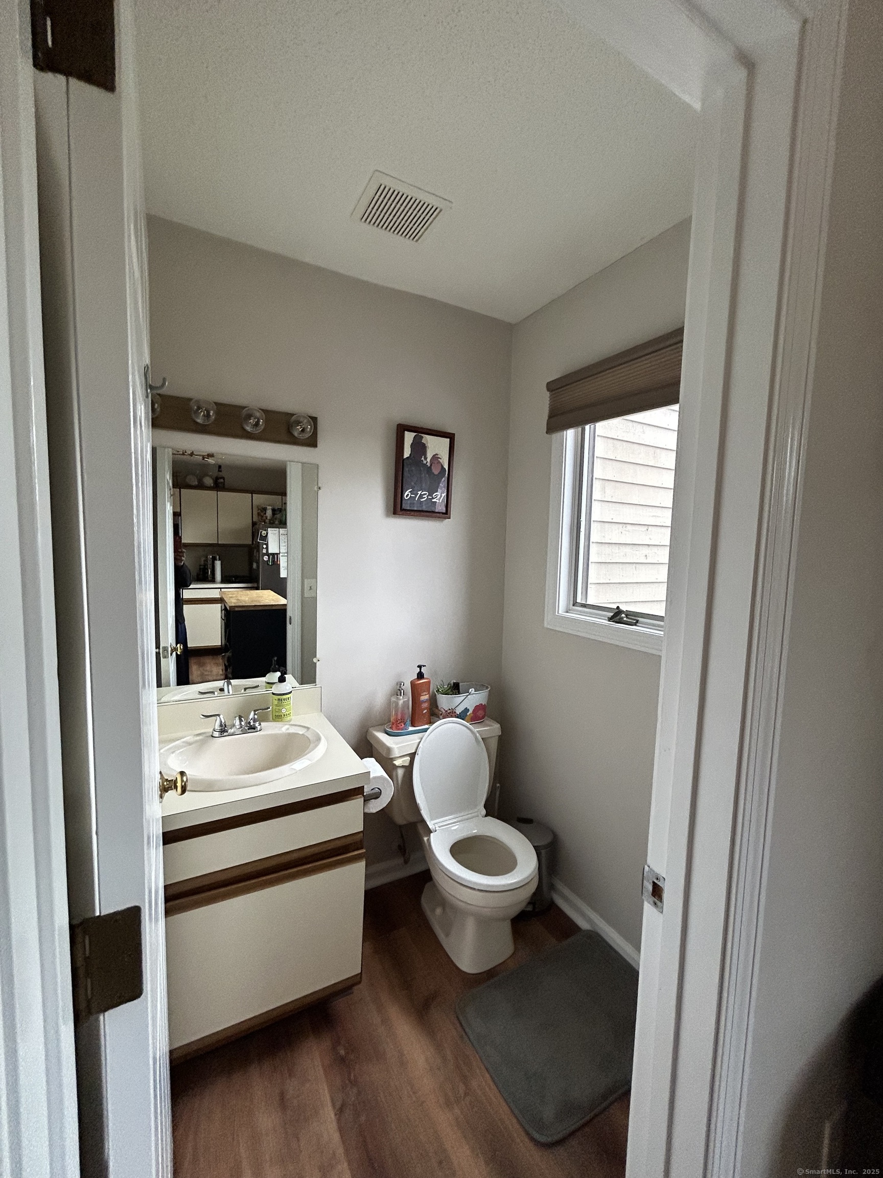 489 Wolcott Street, Unit 85 Bristol, CT 06010 - Photo 4 of 17 a bathroom with a white toilet sink and vanity