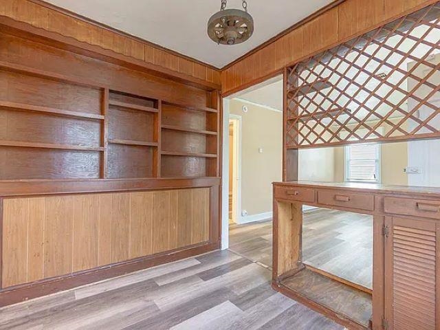 2061 Pendleton Street Memphis, TN 38114 - Photo 7 of 9 a view of an empty room with wooden floor and a window