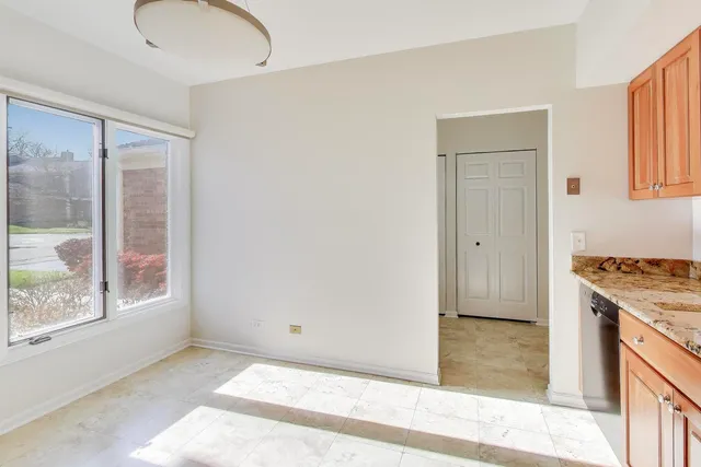 a view of a kitchen from the hallway