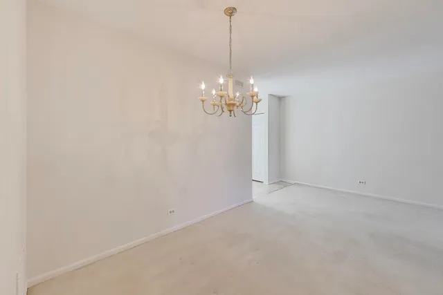 a view of a chandelier in big room