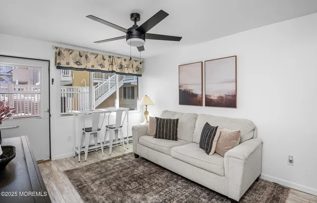 a living room with furniture and a rug