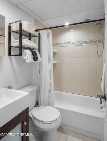 a bathroom with a sink a toilet and a bathtub