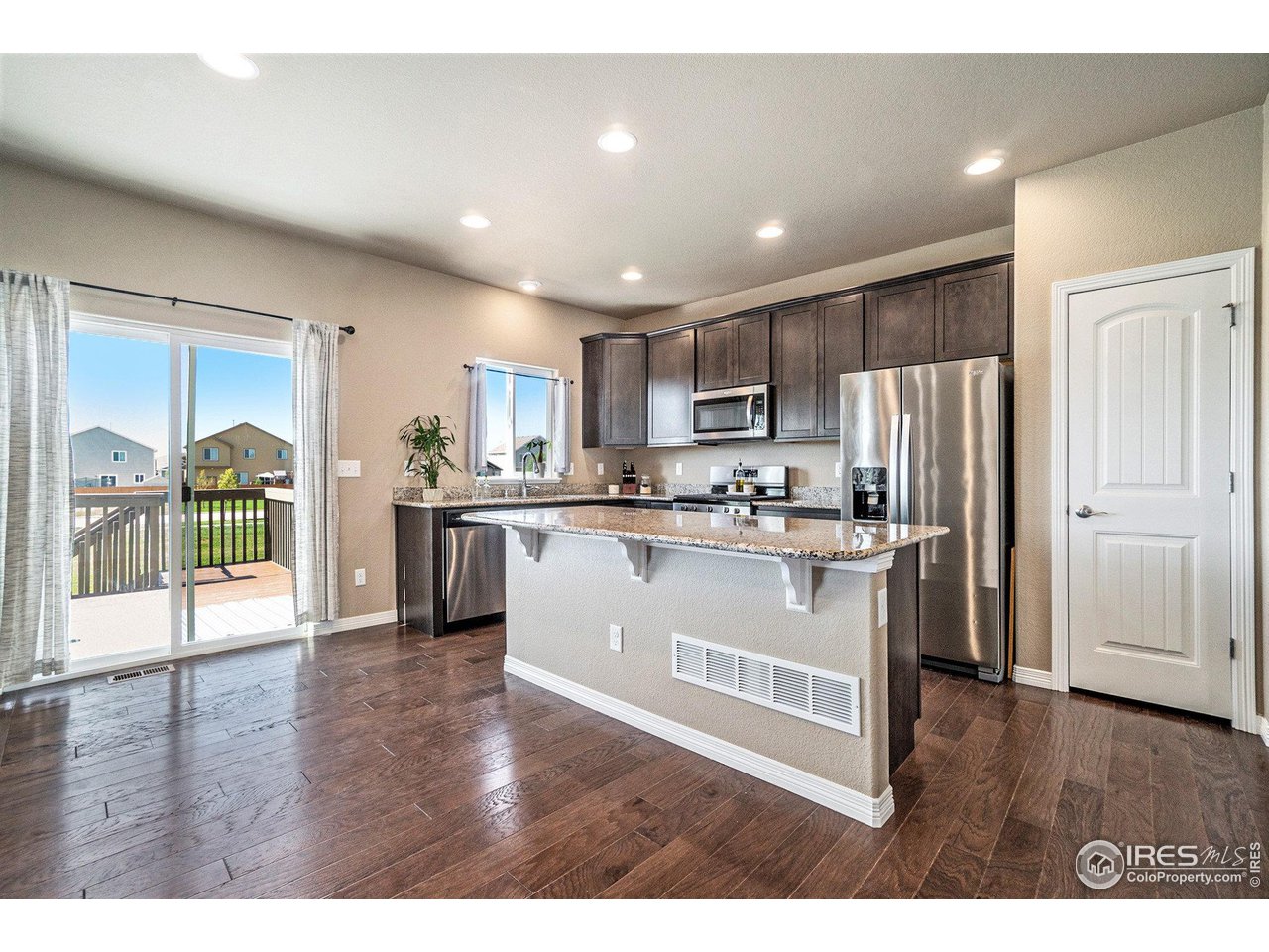 1379 Copeland Falls Road Severance, CO 80550 - Photo 7 of 28 Spacious island for meal prep and cookie making