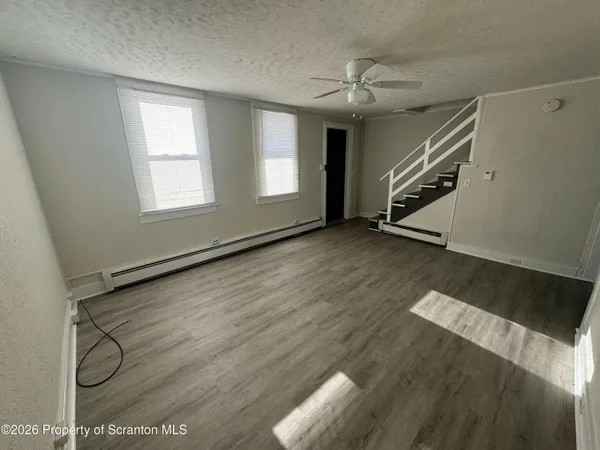 a view of an empty room with a window