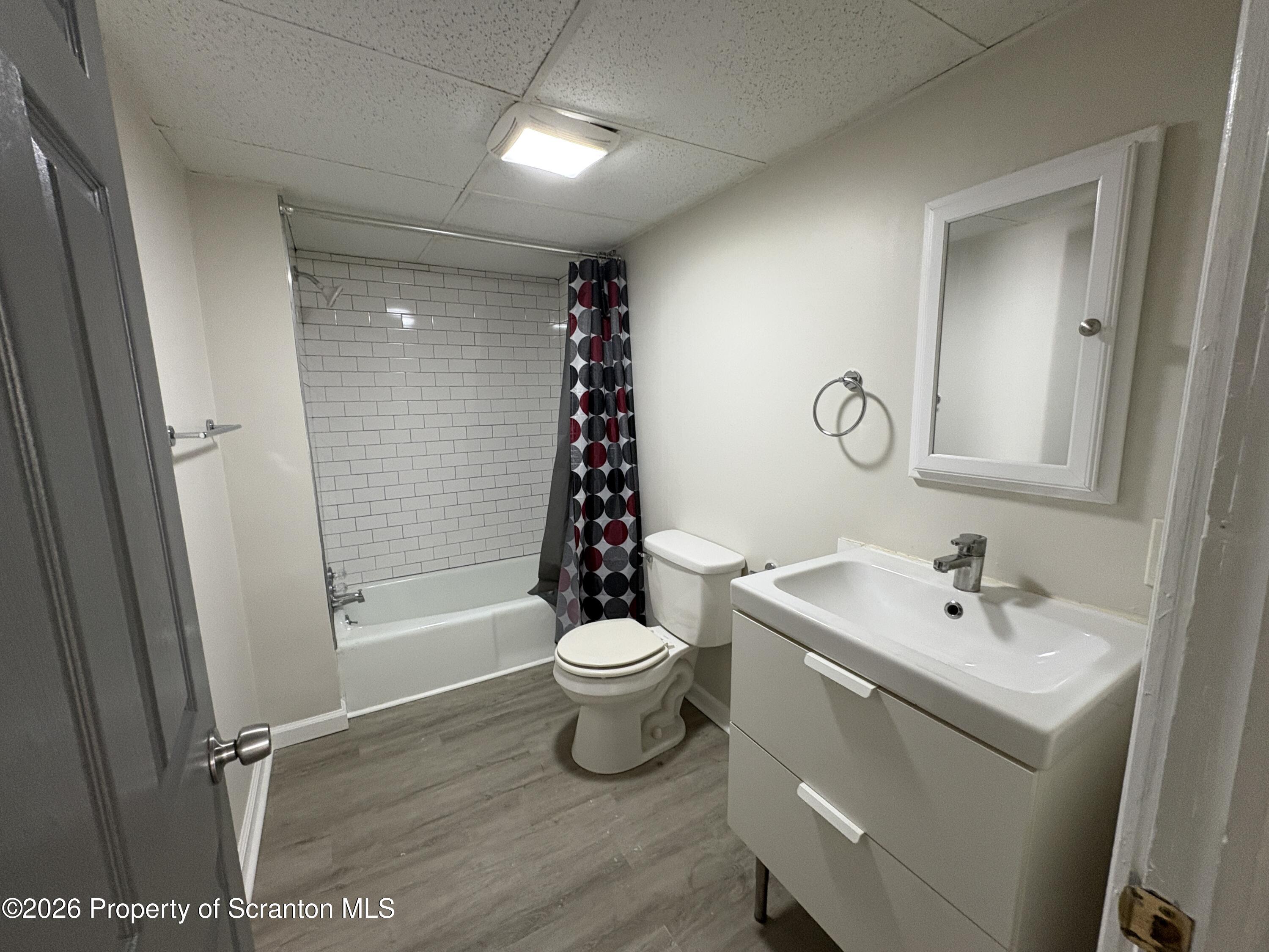 513 Oak Street Old Forge, PA 18518 - Photo 7 of 14 a bathroom with a sink a toilet and shower