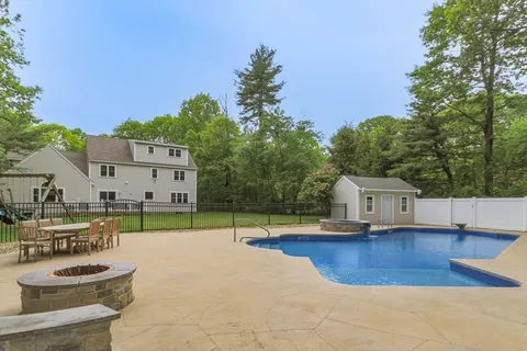 a view of swimming pool with seating space and garden