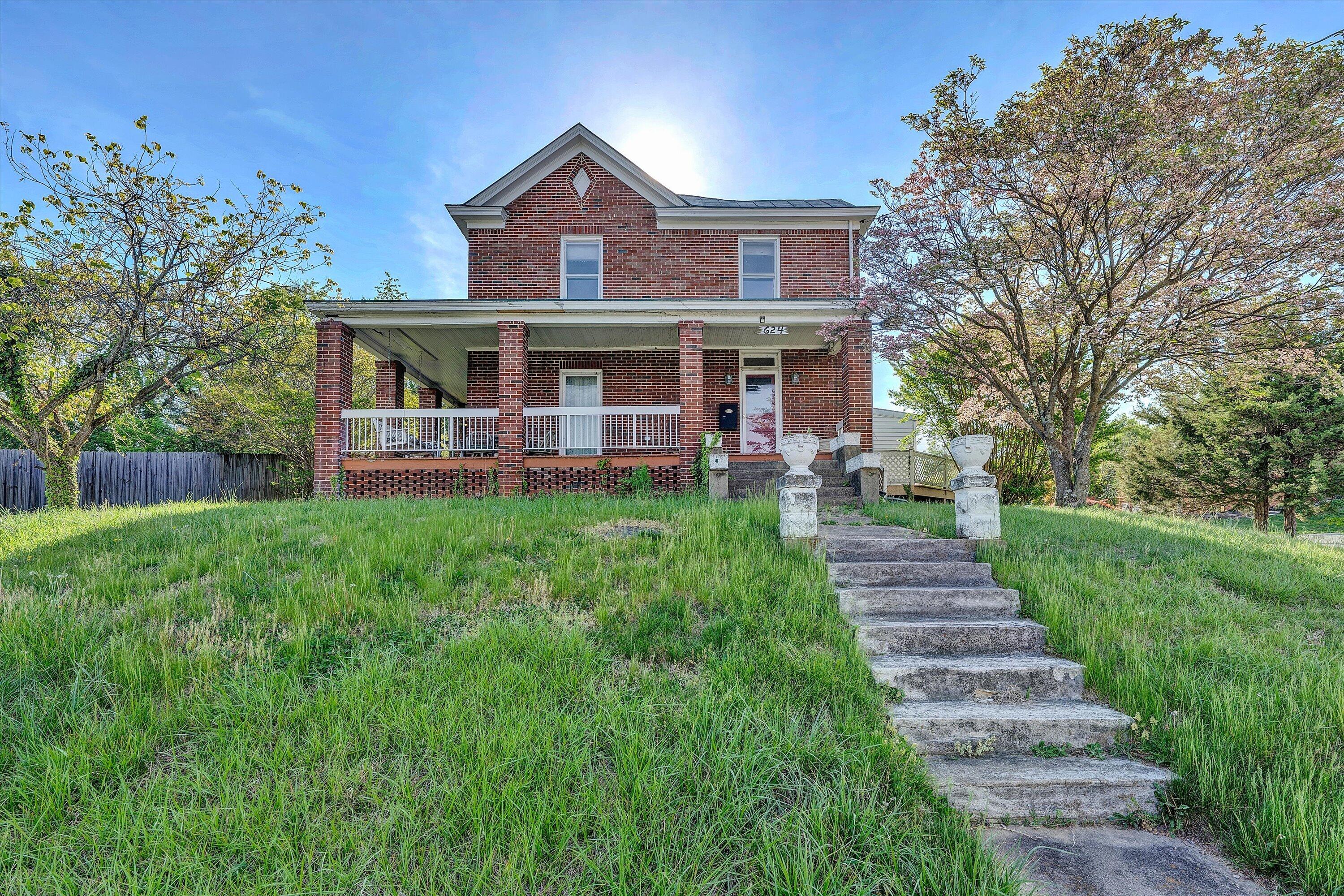 624 South Maple Street Vinton, VA 24179 - Photo 1 of 40 a front view of a house with a yard table and chairs
