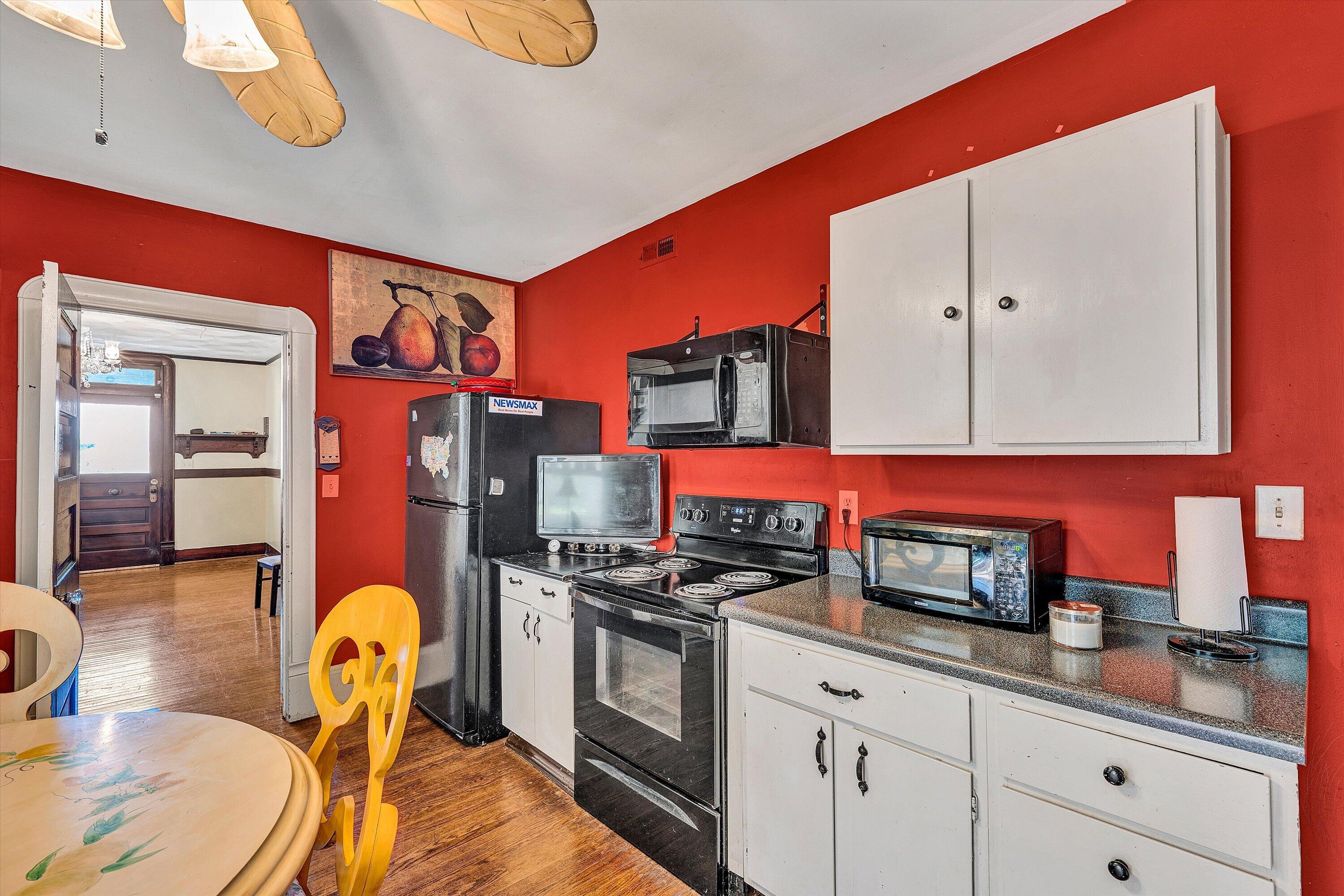 624 South Maple Street Vinton, VA 24179 - Photo 12 of 40 a kitchen with stainless steel appliances granite countertop a stove a sink and a microwave