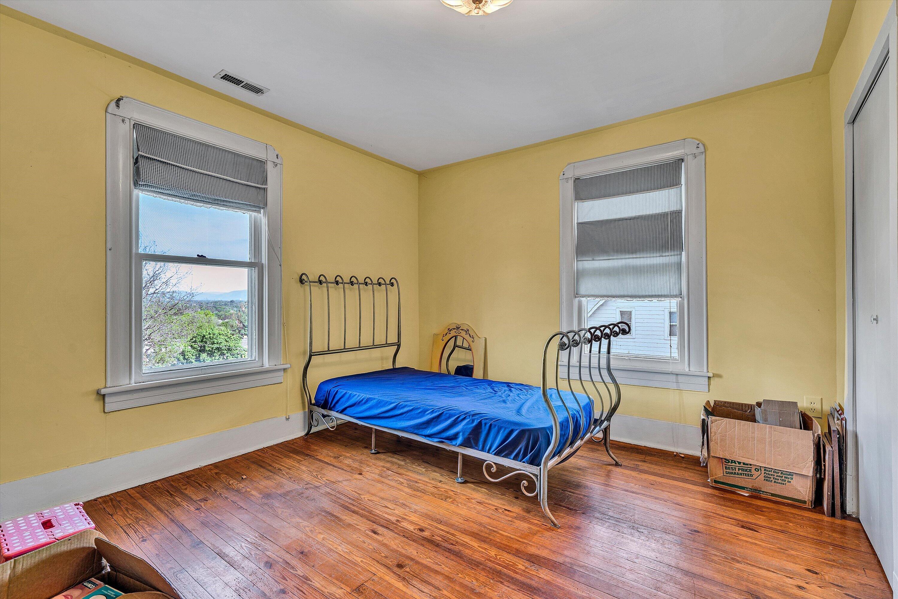 624 South Maple Street Vinton, VA 24179 - Photo 23 of 40 a living room with a bed furniture and a window