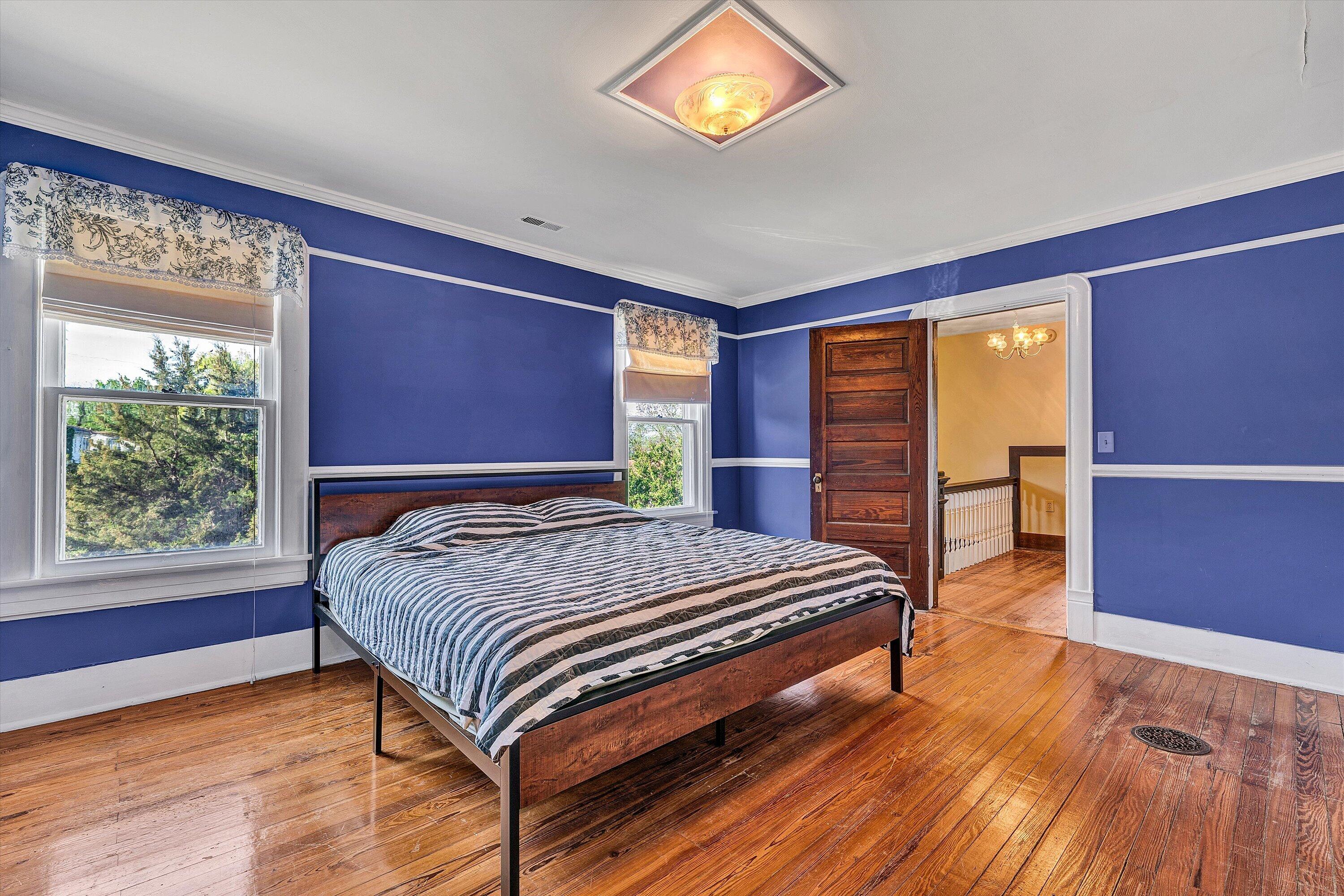 624 South Maple Street Vinton, VA 24179 - Photo 28 of 40 a bedroom with a bed and a dresser next to a window