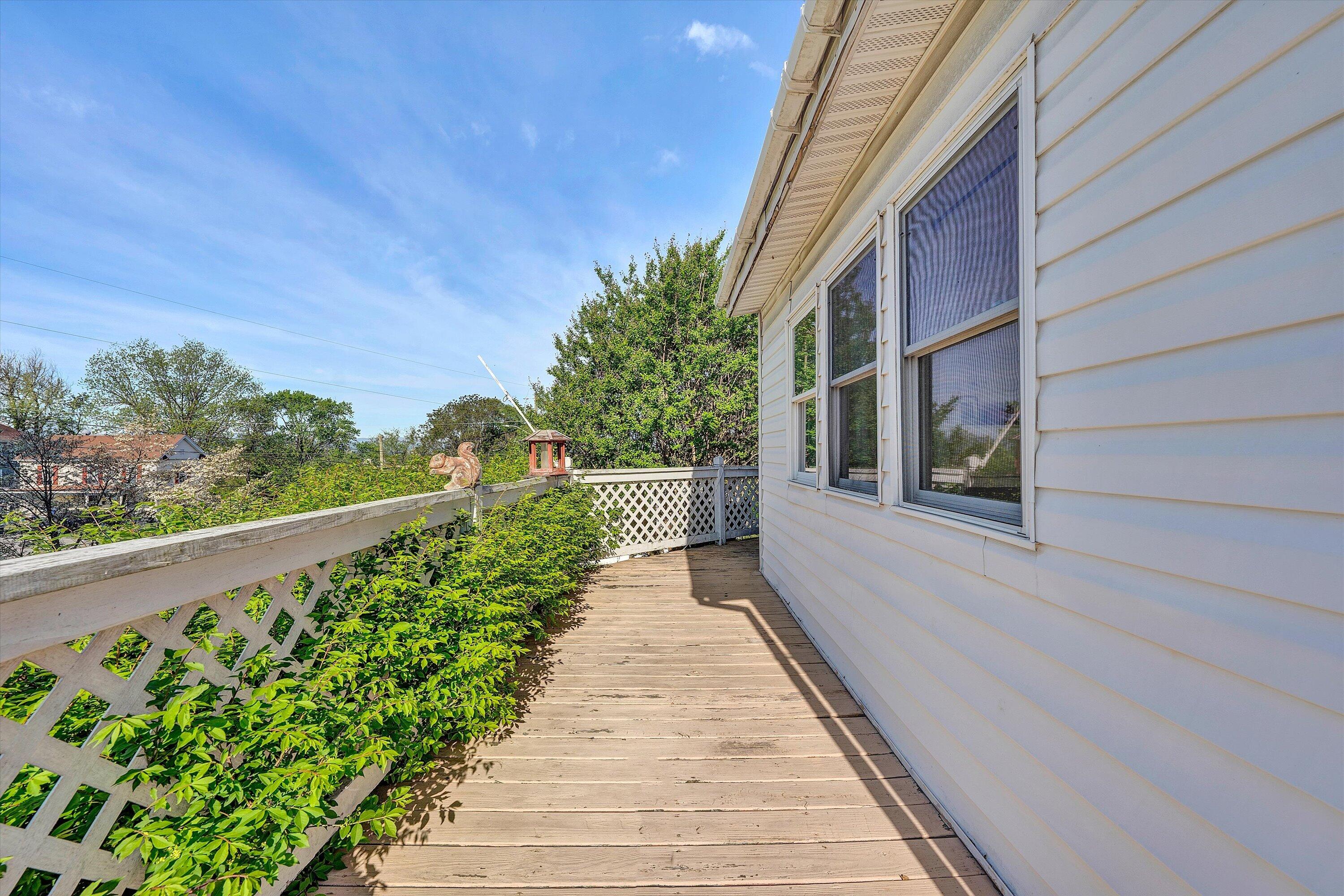 624 South Maple Street Vinton, VA 24179 - Photo 30 of 40 a view of a balcony with wooden floor and fence