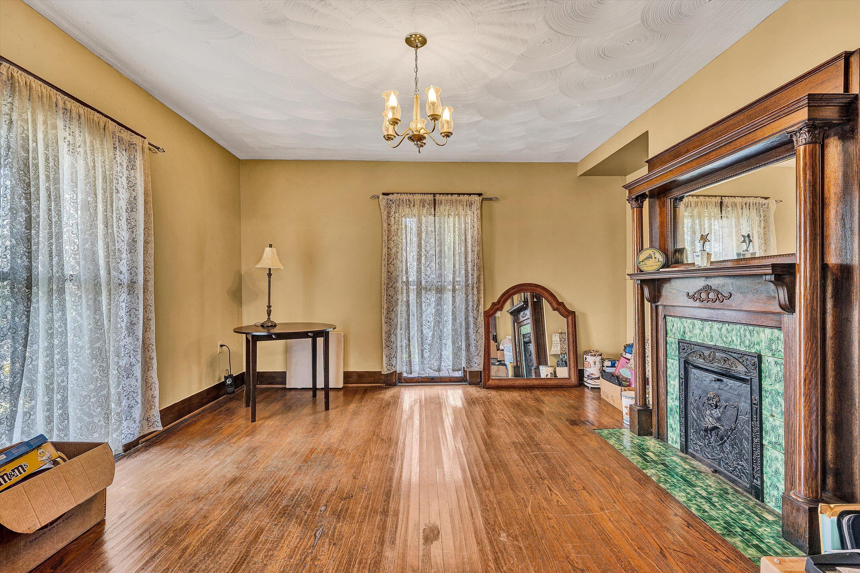 624 South Maple Street Vinton, VA 24179 - Photo 7 of 40 a view of a livingroom with furniture window wooden floor and front door