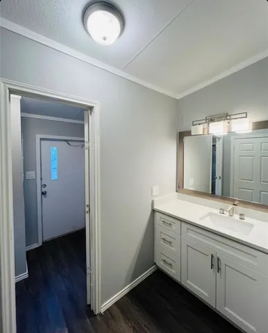 a bathroom with a double vanity sink and mirror