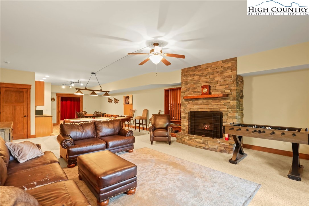 138 South Camp Road, Unit 103 Boone, NC 28607 - Photo 34 of 50 a living room with furniture and a fireplace
