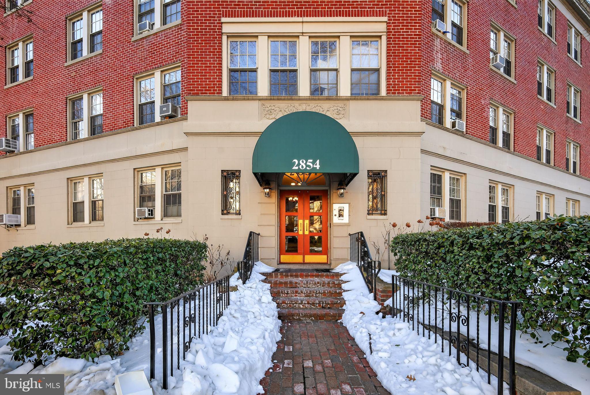 2854 Connecticut Avenue Northwest, Unit 32 Washington, DC 20008 - Photo 1 of 13 a front view of a brick house many windows