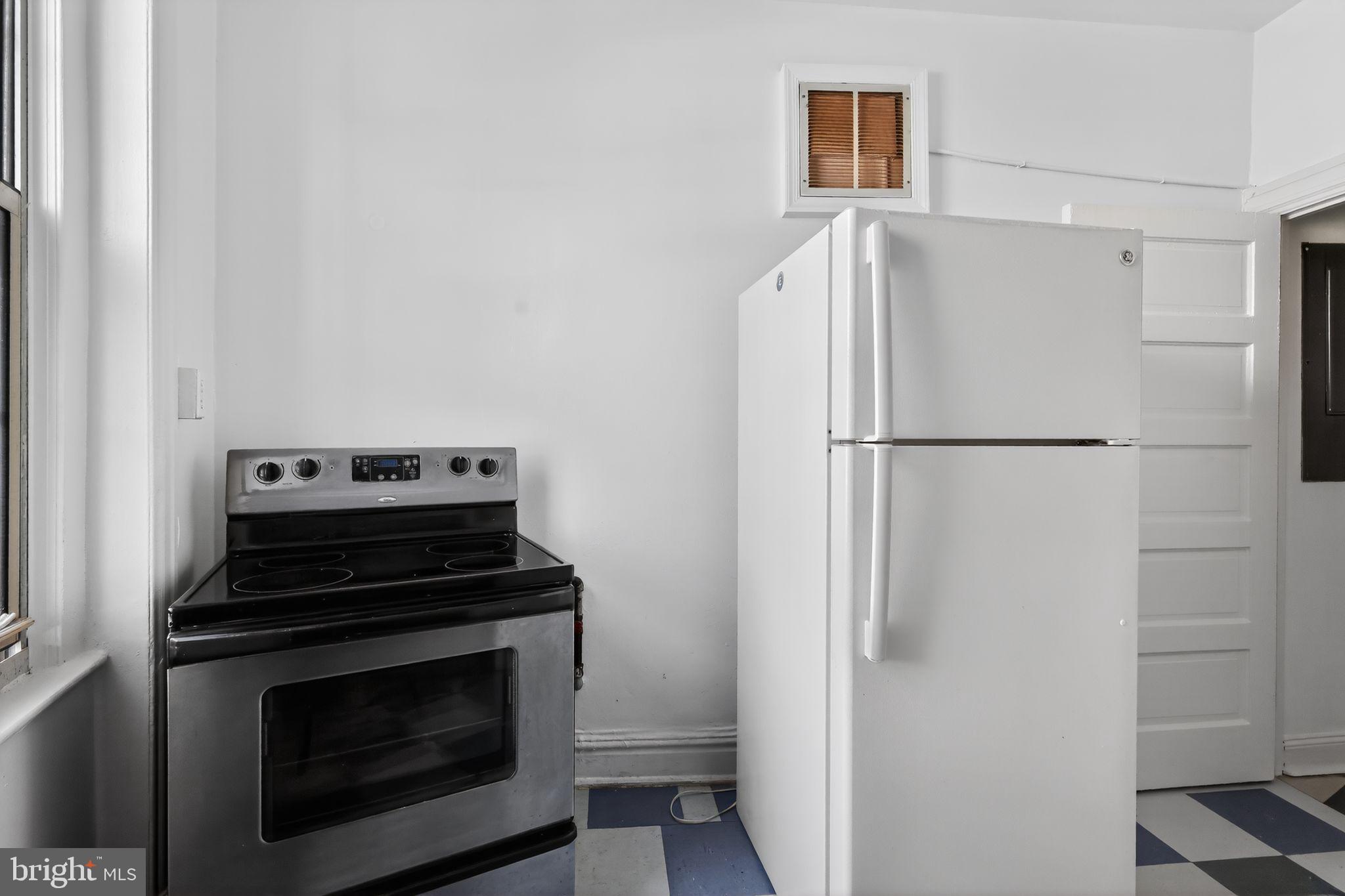 2854 Connecticut Avenue Northwest, Unit 32 Washington, DC 20008 - Photo 12 of 12 a kitchen with a stove and a refrigerator
