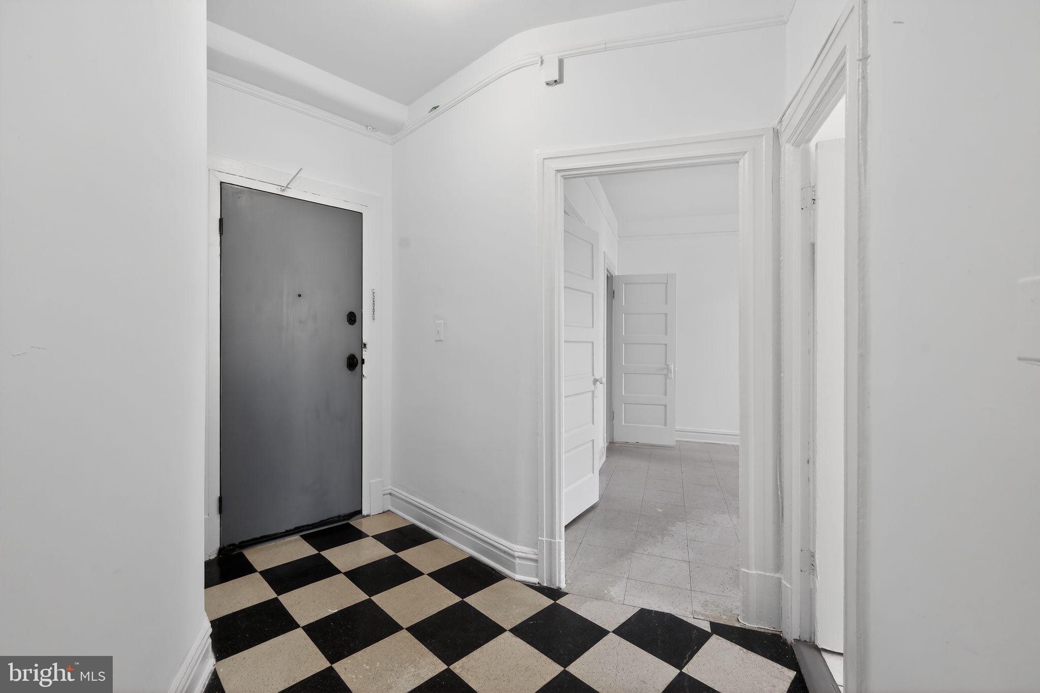 2854 Connecticut Avenue Northwest, Unit 32 Washington, DC 20008 - Photo 4 of 12 a walk in closet with a black white checkered floor