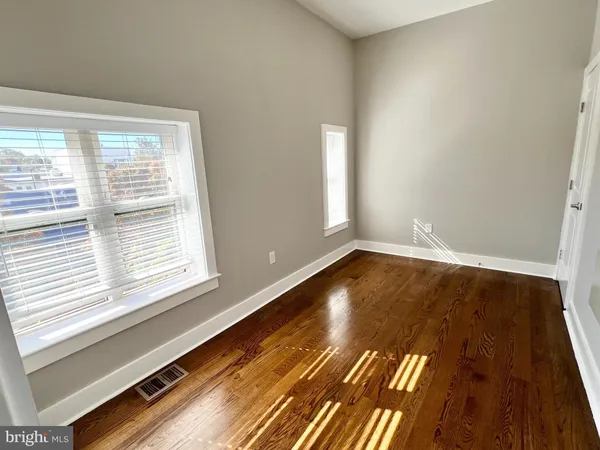 a view of wooden floor and brick walls