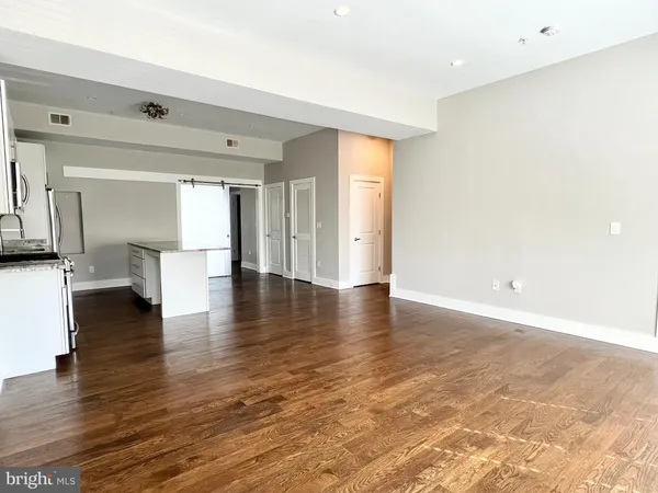 a view of a livingroom with wooden floor