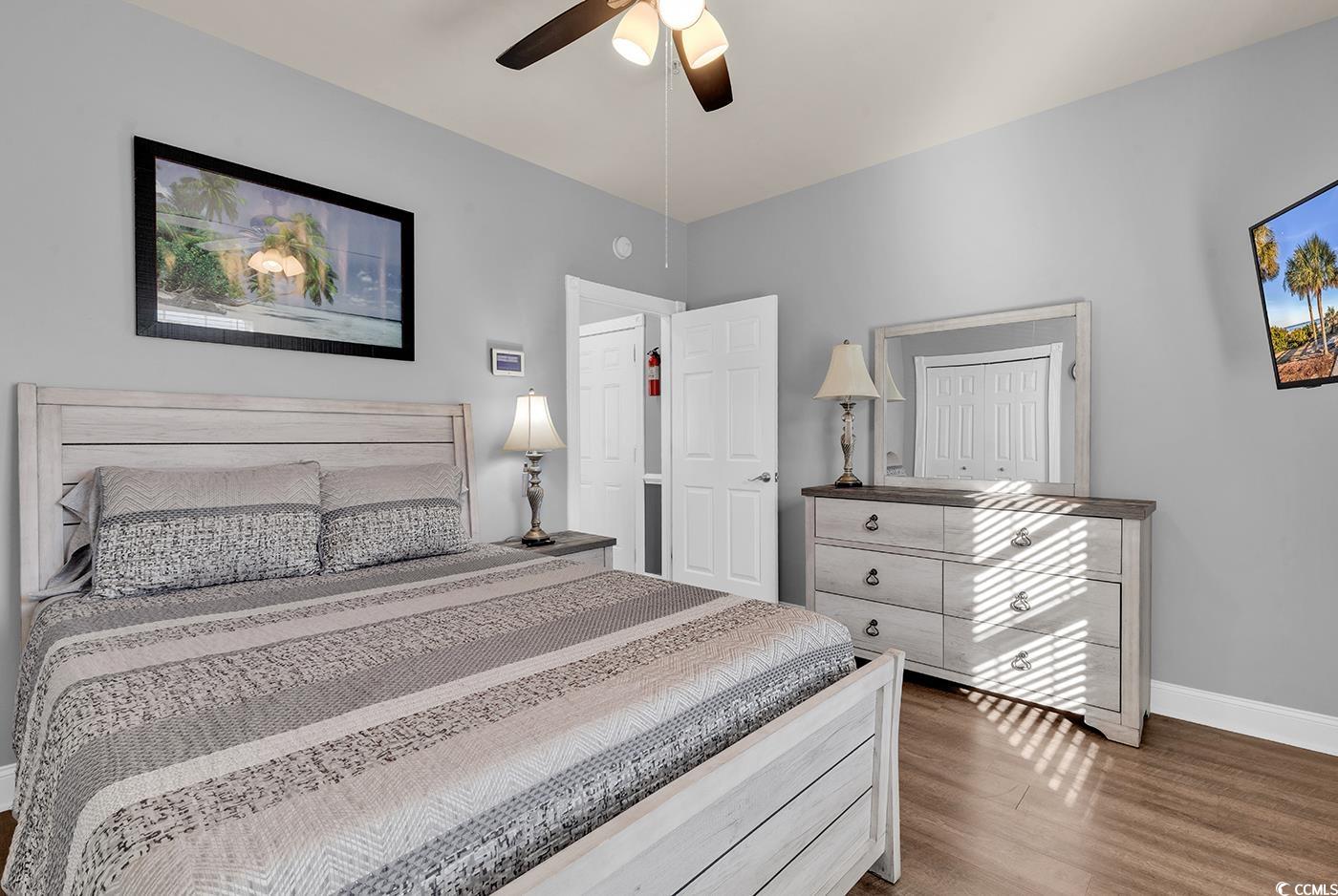 4829 Luster Leaf Circle, Unit 301 Myrtle Beach, SC 29577 - Photo 17 of 34 Bedroom featuring light wood finished floors and a ceiling fan
