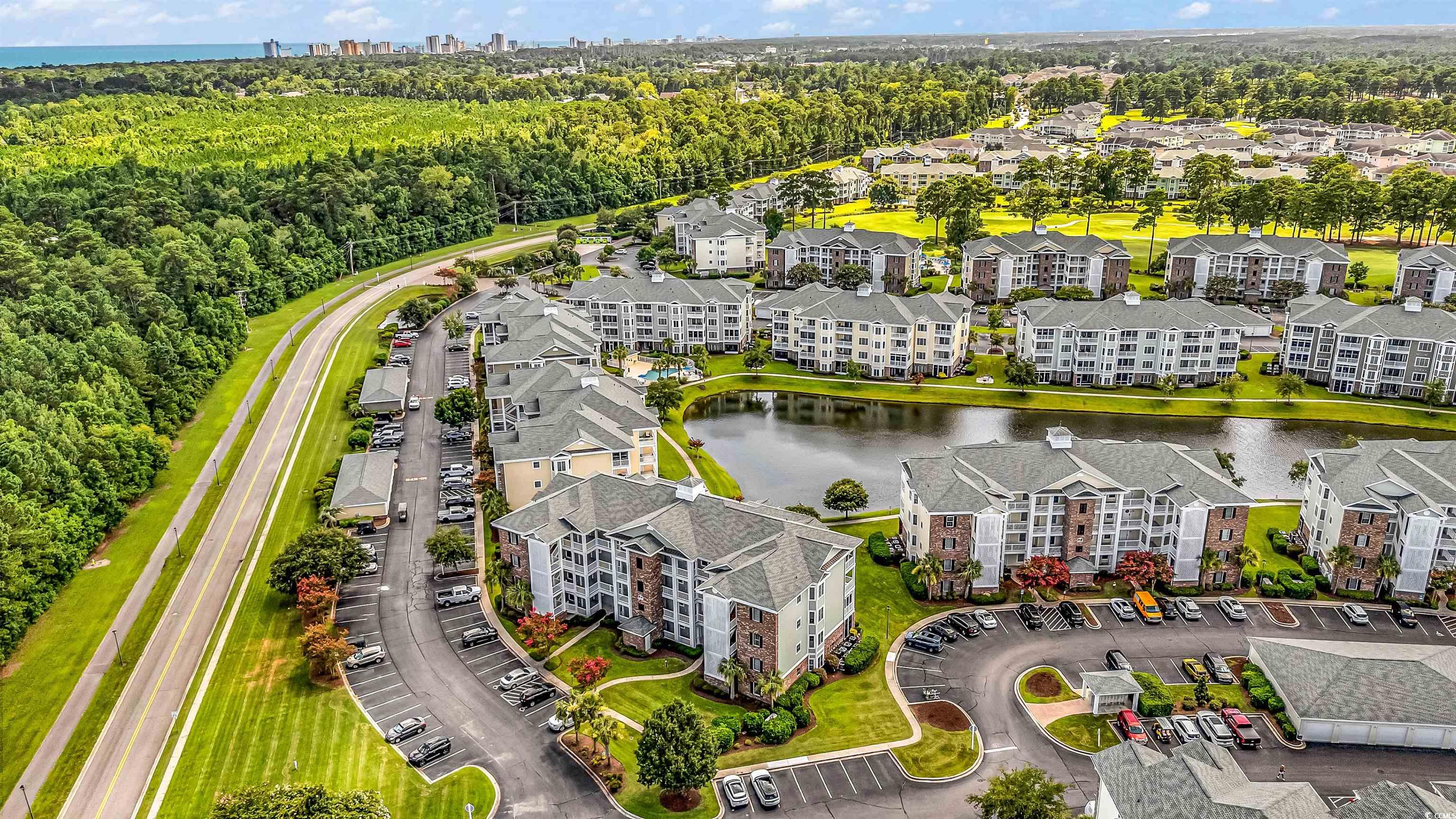 4829 Luster Leaf Circle, Unit 301 Myrtle Beach, SC 29577 - Photo 3 of 34 Drone / aerial view of a large body of water