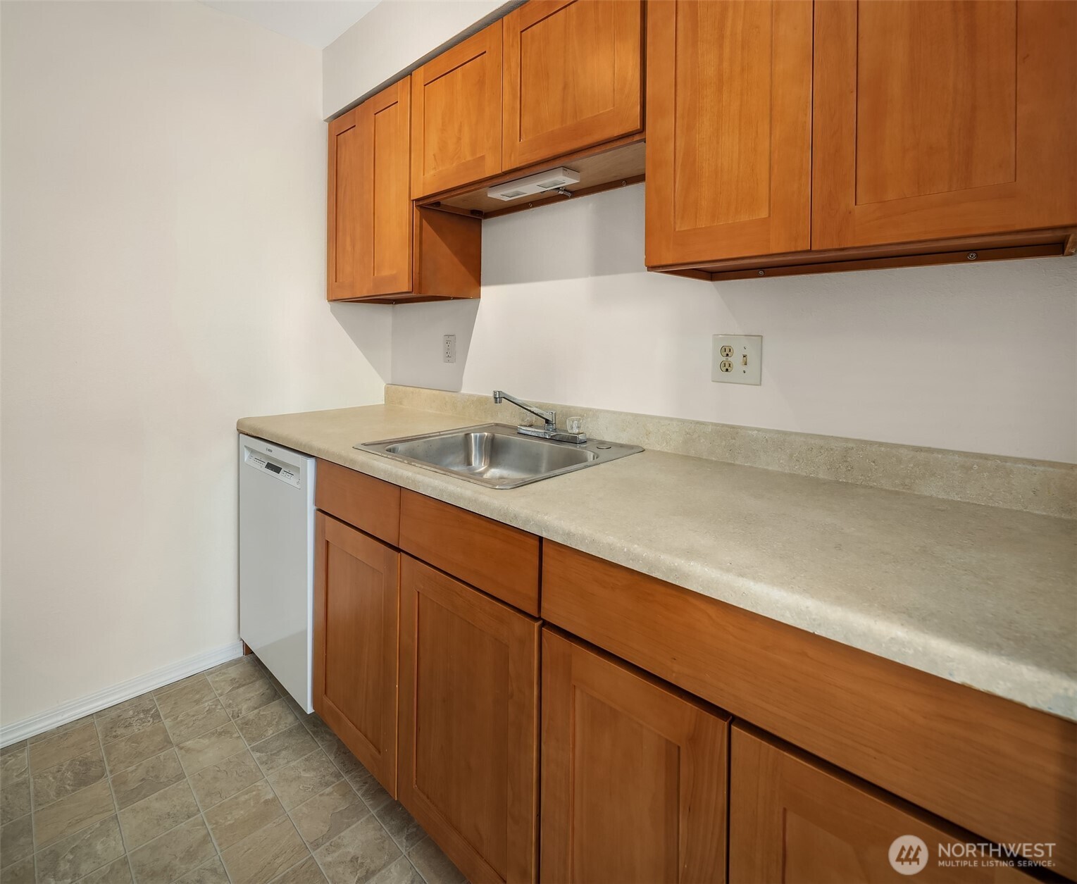 12424 Northeast 145th Street, Unit C25 Kirkland, WA 98034 - Photo 17 of 40 a kitchen with a sink and cabinets