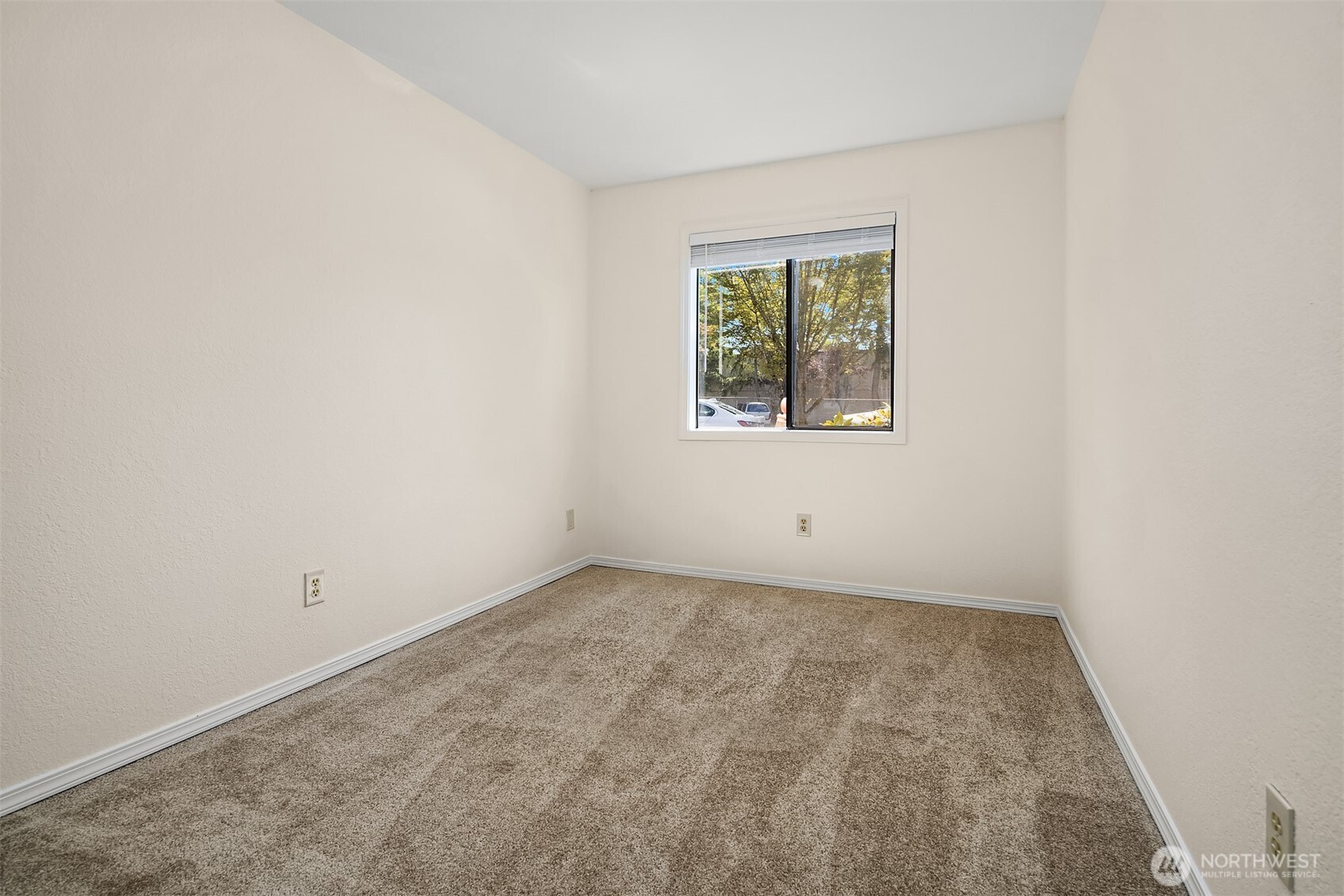 12424 Northeast 145th Street, Unit C25 Kirkland, WA 98034 - Photo 20 of 40 an empty room with a window
