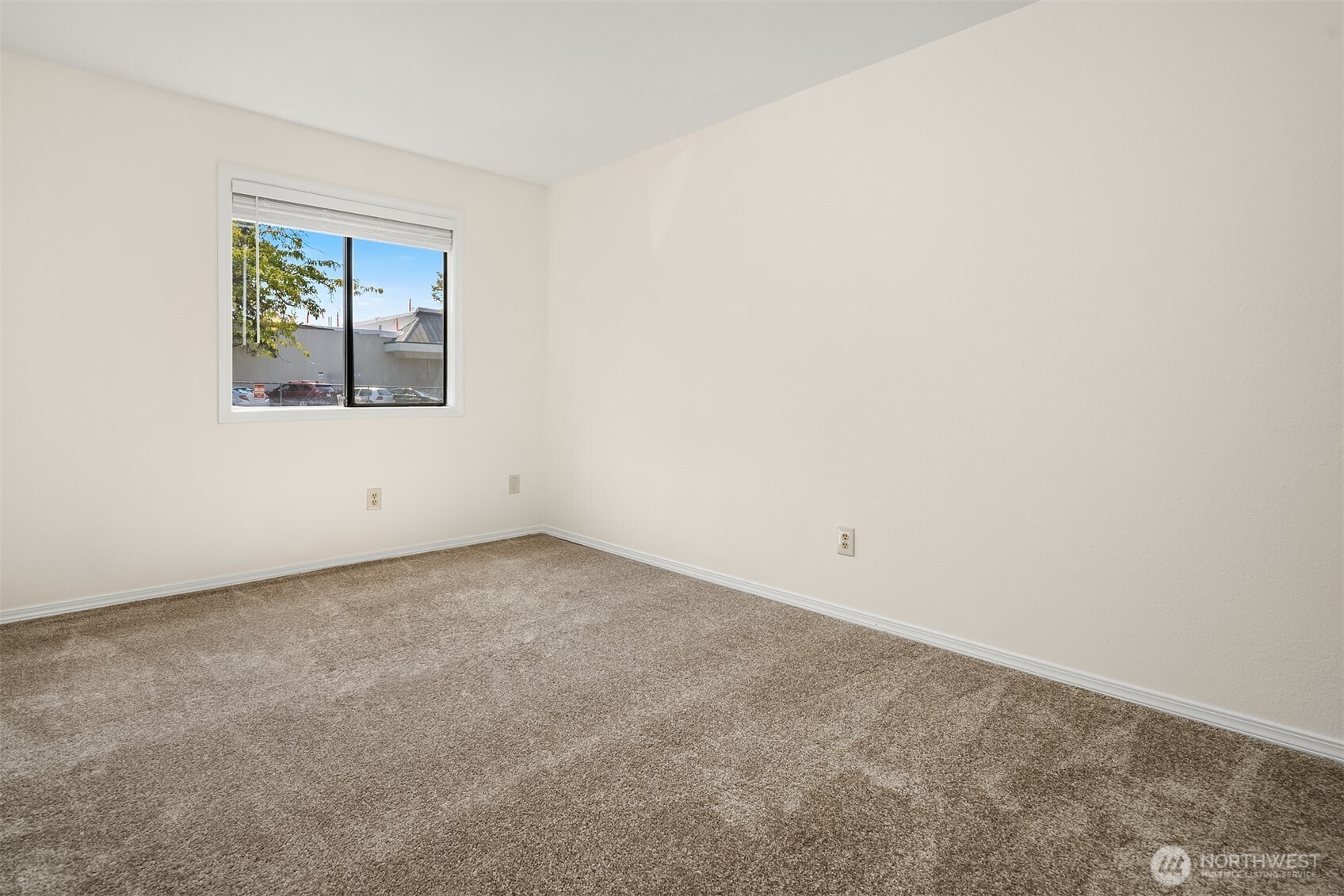 12424 Northeast 145th Street, Unit C25 Kirkland, WA 98034 - Photo 22 of 40 an empty room with a window