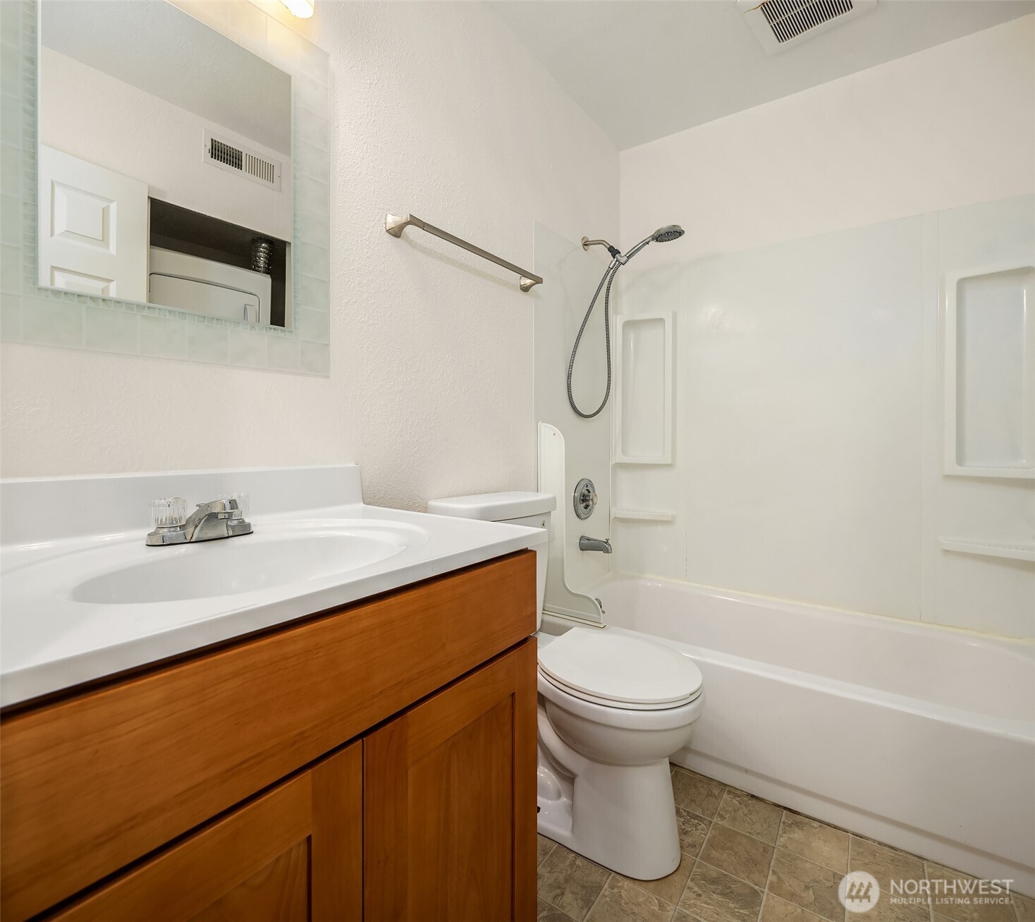 12424 Northeast 145th Street, Unit C25 Kirkland, WA 98034 - Photo 28 of 40 a bathroom with a sink a toilet and a bathtub