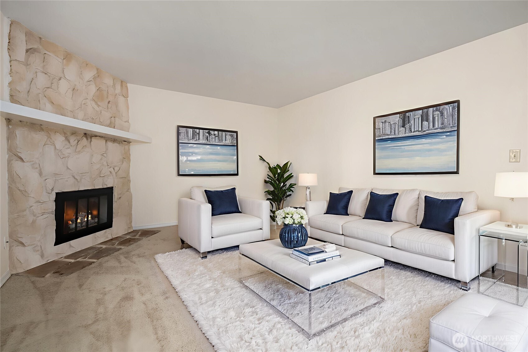 12424 Northeast 145th Street, Unit C25 Kirkland, WA 98034 - Photo 4 of 40 a living room with furniture a rug and a fireplace