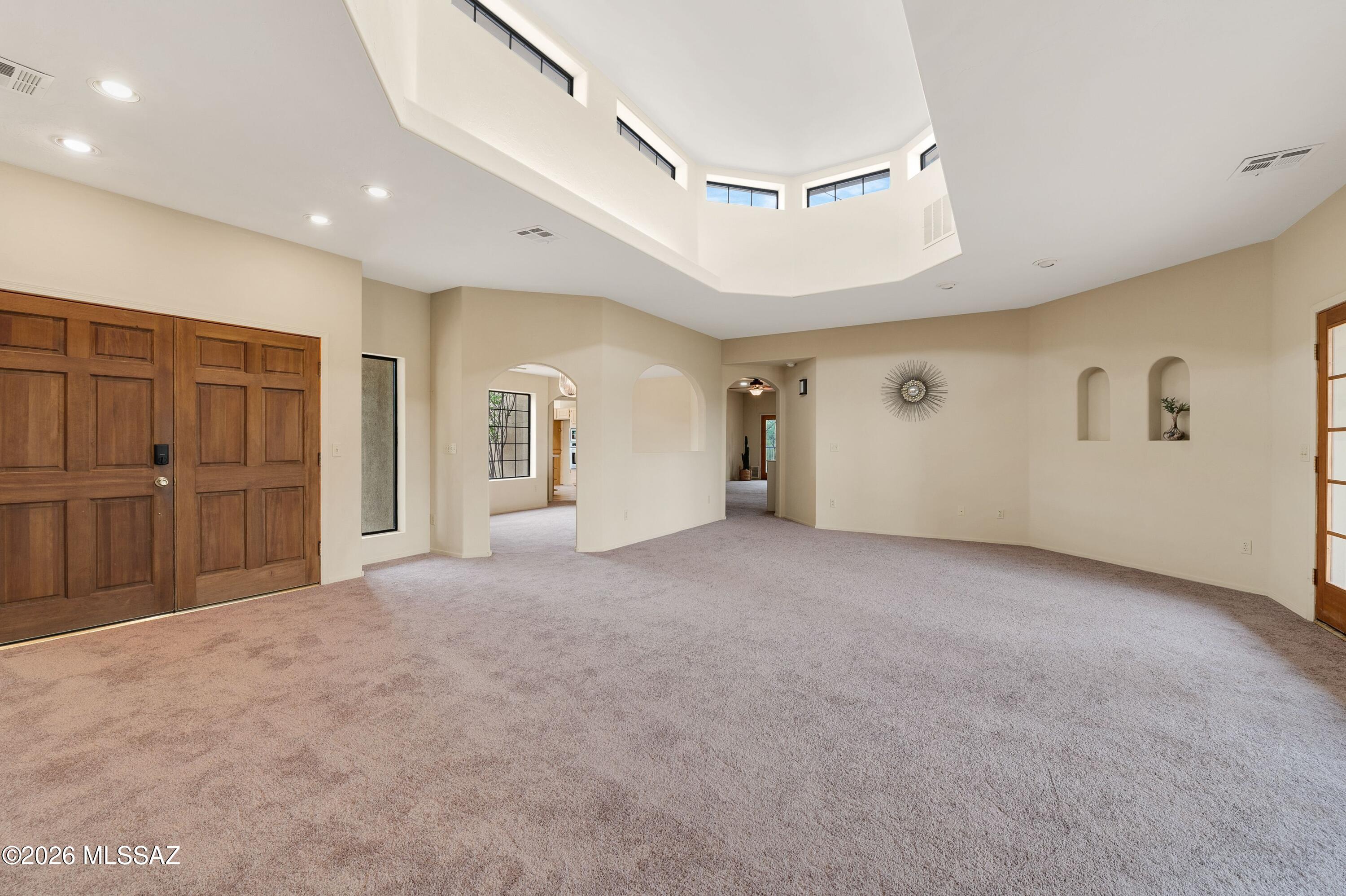 12160 East Tanque Verde Road Tucson, AZ 85749 - Photo 17 of 53 Archways connect to the bedroom wing and family areas, and arched display niches.