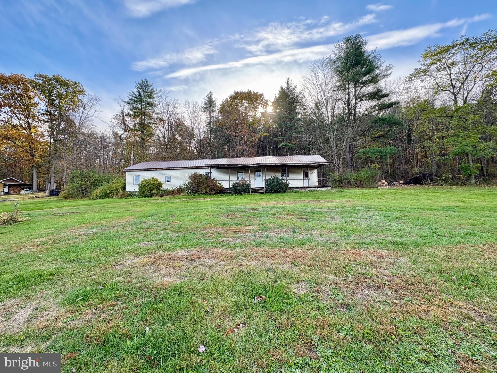 127 Evergreen Road Blanchard, PA 16826 - Photo 14 of 14 a view of a green field with wooden fence