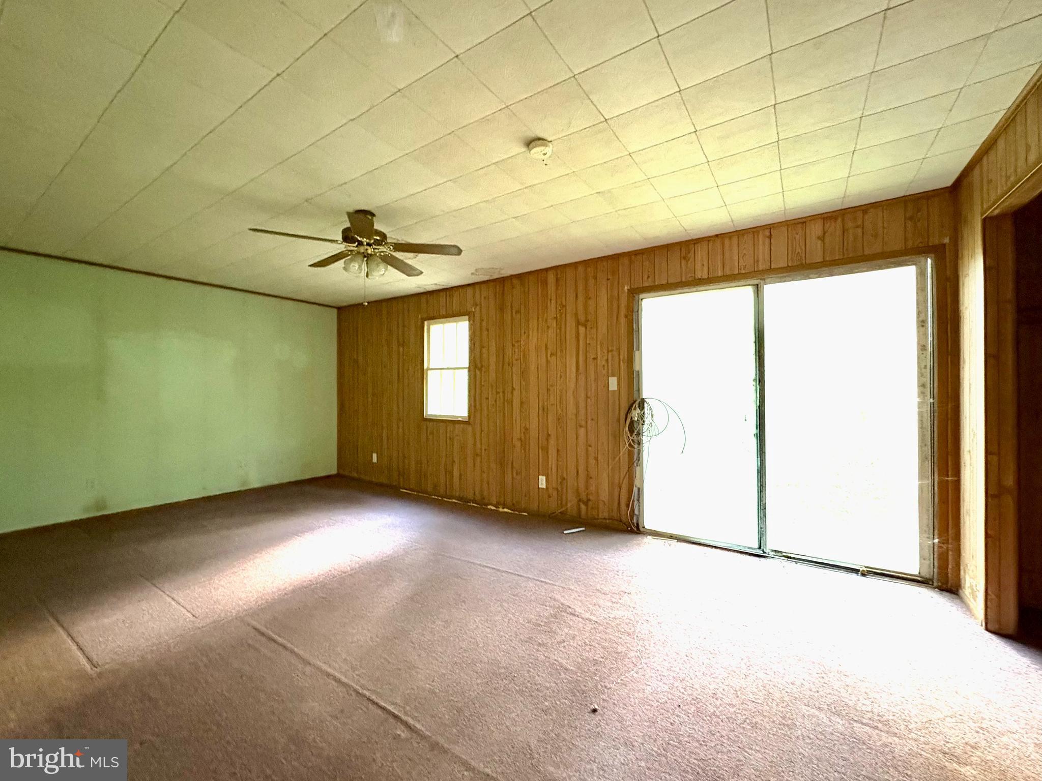 127 Evergreen Road Blanchard, PA 16826 - Photo 4 of 14 a view of an empty room with a window
